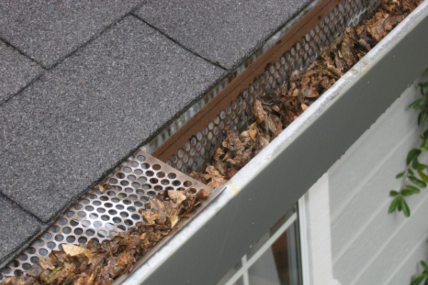 Overloaded gutters - DownUnderRoofing.com - Nebraska, Kansas, Iowa