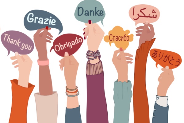Raised arms and hands of multi-ethnic people from different nations and continents holding speech bubbles with text -thank you- in various international languages.Communication.Equality